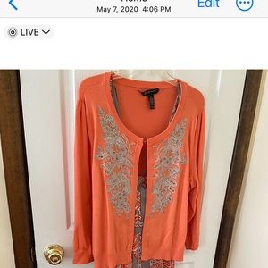 Orange cardigan sweater. Front is sewn with beautiful crystals